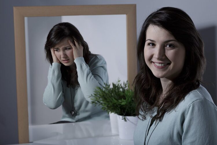 Smiling pretty young girl with bipolar disorder