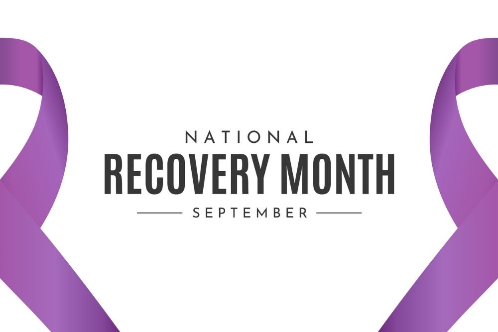 Graphic design with purple awareness ribbons and the words 'National Recovery Month September' in bold text on a white background.
